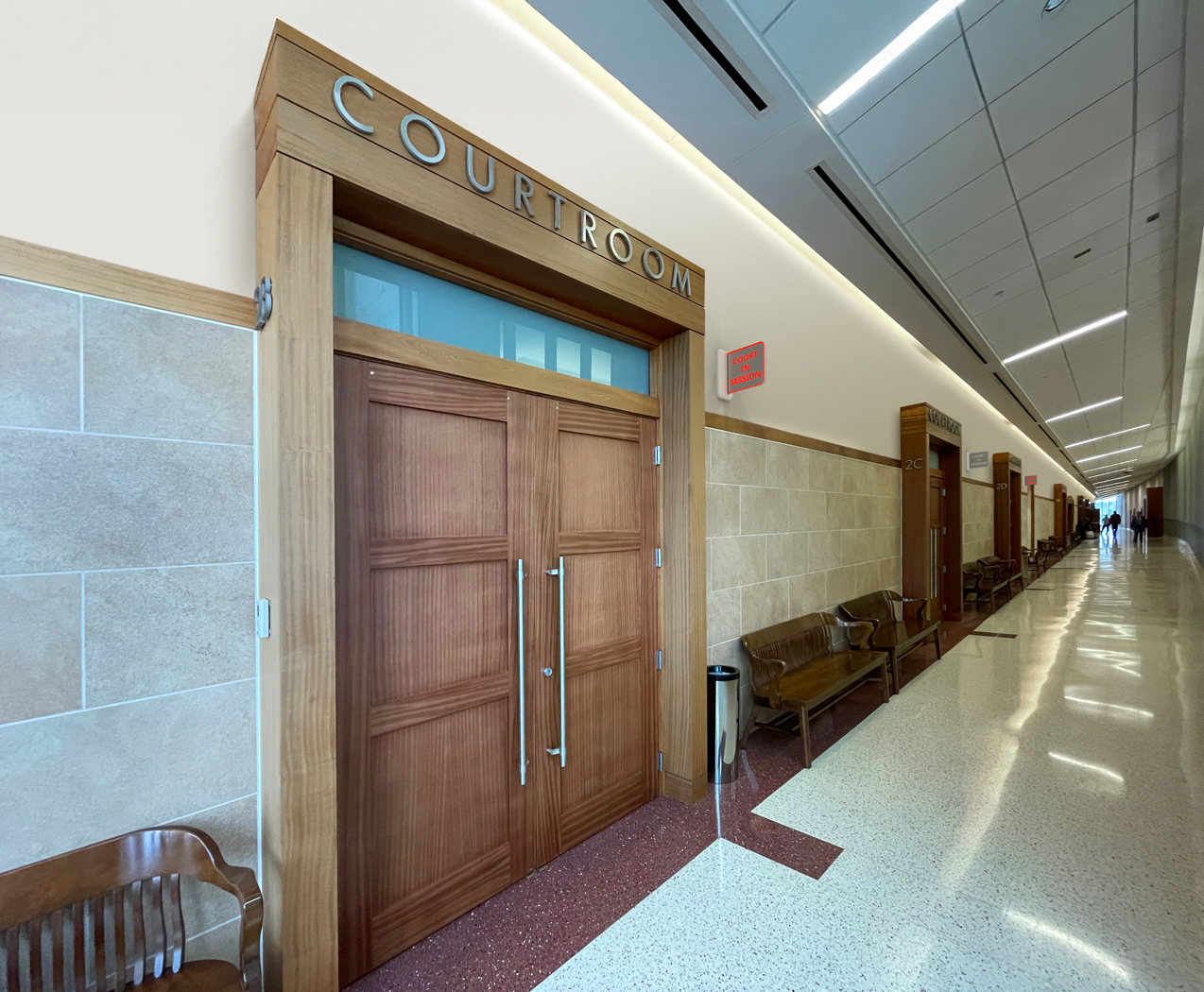 Using the SSI 100W in Secure Platform Device mode, the 1st courtroom status is illuminated red (Court in Session), and the 2nd courtroom status is not illuminated (not in use). 